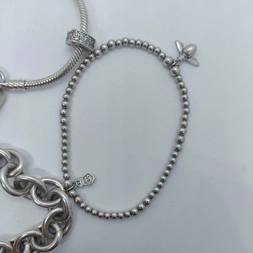 113 - A silver bracelet, with dog tags, and two other bracelets