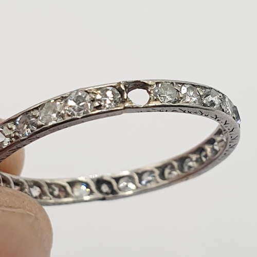 11 - A diamond eternity ring, ring size L 1/2