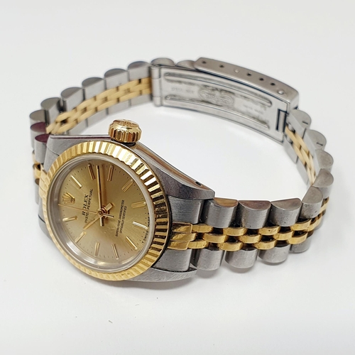 467 - A ladies stainless steel and gold Rolex Oyster Perpetual wristwatch, with two spare links, boxes and... 