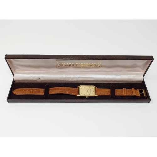 468 - A gold plated Girard Perregaux wristwatch on a leather strap