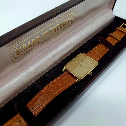 468 - A gold plated Girard Perregaux wristwatch on a leather strap