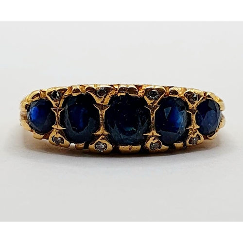 5 - An 18ct gold and sapphire five stone ring, ring size P