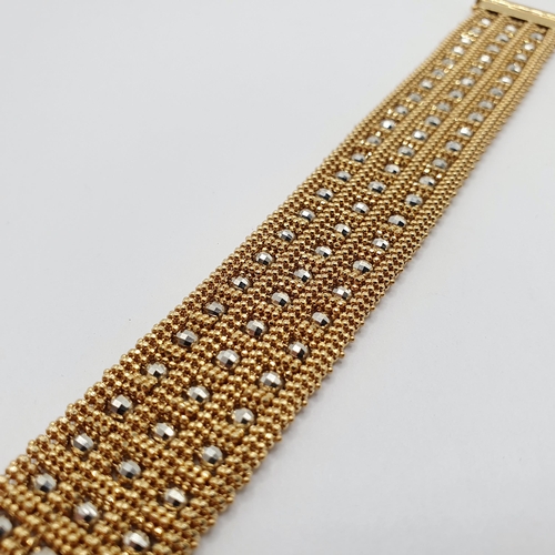 56 - A Swiss 18ct gold and metal bead bracelet, all in 42 g  Provenance: From a large single owner collec... 