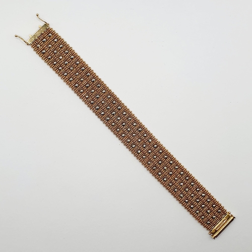 56 - A Swiss 18ct gold and metal bead bracelet, all in 42 g  Provenance: From a large single owner collec... 