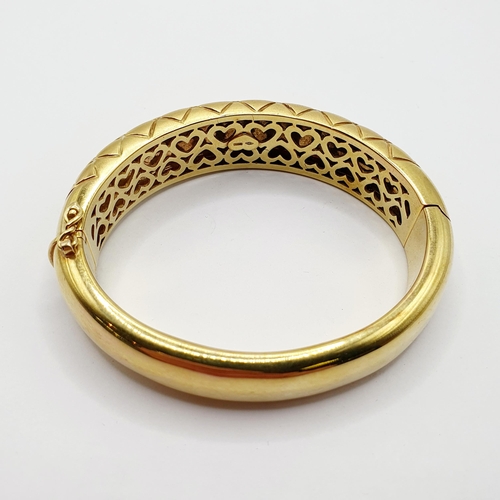 60 - An 18ct gold hinged bangle, 65 g  Provenance: From a large single owner collection of jewellery cons... 