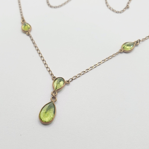 7 - A 9ct gold and peridot necklace  Provenance: From a large single owner collection of jewellery consi... 