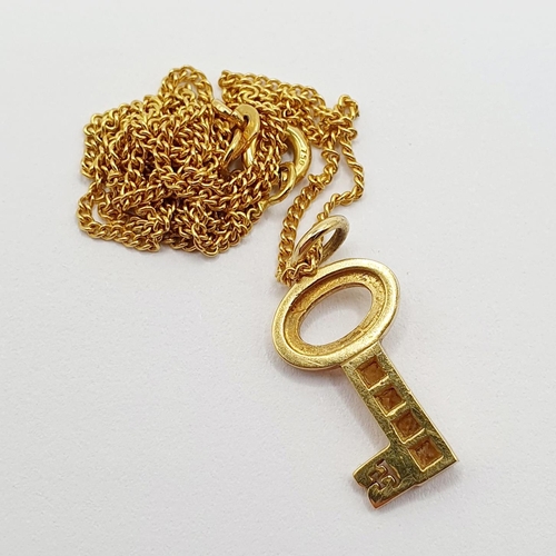 81 - An Italian 18ct gold chain, with a yellow metal and yellow stone pendant, in the form of a key  Prov... 