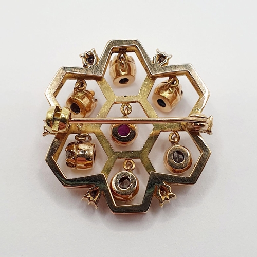 87 - A yellow metal, diamond and ruby brooch