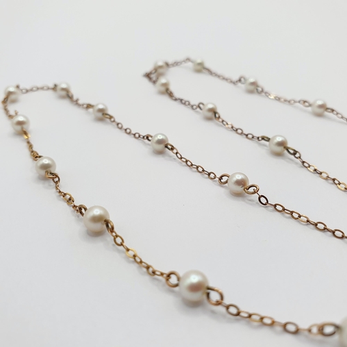 90 - A yellow metal and pearl necklace  Provenance: From a large single owner collection of jewellery con... 