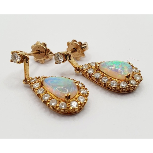 91 - A pair of 18ct gold, opal and diamond teardrop earrings