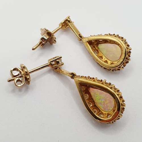 91 - A pair of 18ct gold, opal and diamond teardrop earrings