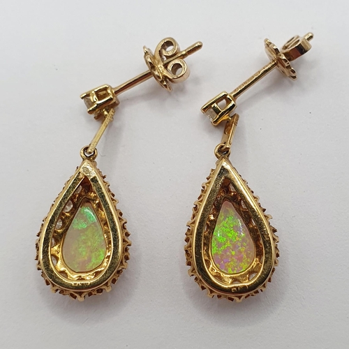 91 - A pair of 18ct gold, opal and diamond teardrop earrings