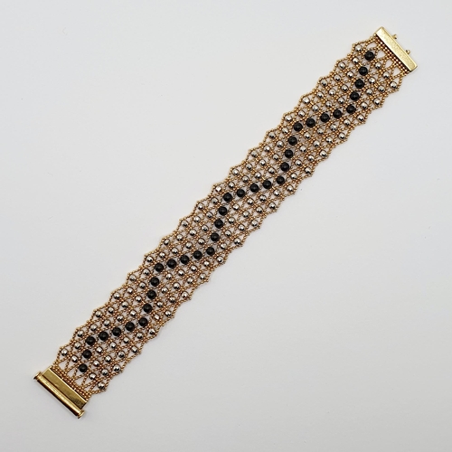 93 - A Swiss 18ct gold and metal bead bracelet
Provenance: From a large single owner collection of jewell... 