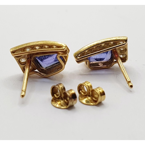 95 - A pair of 18ct gold, tanzanite and diamond stud earrings  Provenance: From a large single owner coll... 