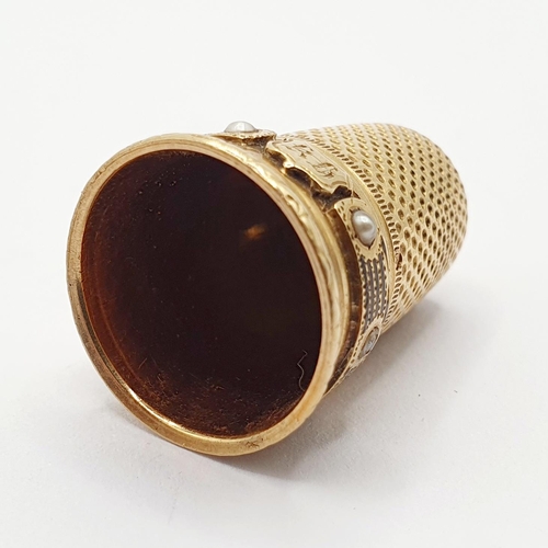 98 - A 19th century yellow metal thimble