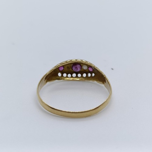 130 - An 18ct gold, ruby and diamond ring, ring size R