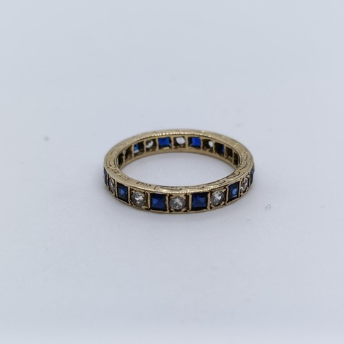 6 - A yellow metal, sapphire and diamond full eternity ring, ring size N  Provenance: From a large singl... 