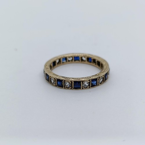 6 - A yellow metal, sapphire and diamond full eternity ring, ring size N  Provenance: From a large singl... 