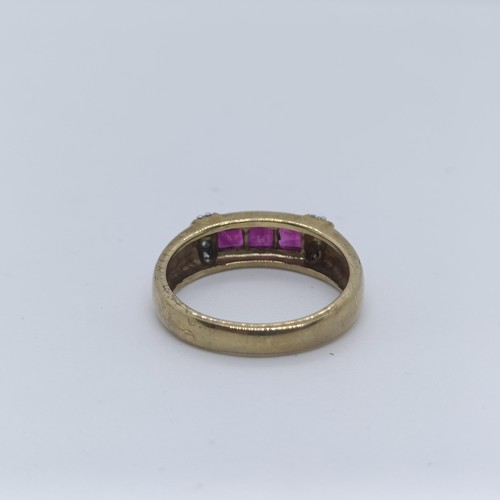 141 - An 9ct gold, ruby and diamond ring, ring size O