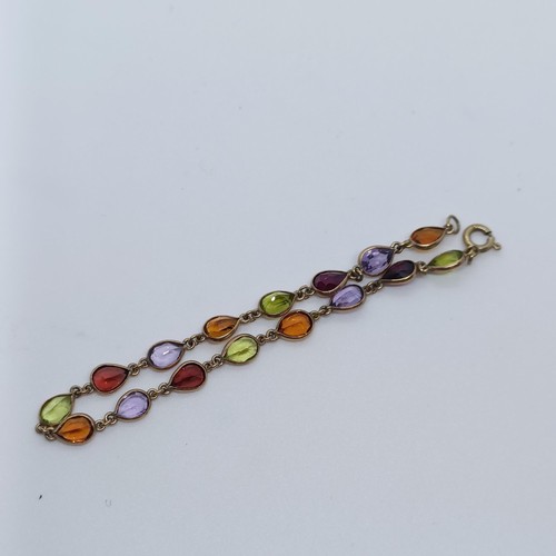 154 - A yellow metal and multi-coloured stone bracelet   Provenance: From a large single owner collection ... 