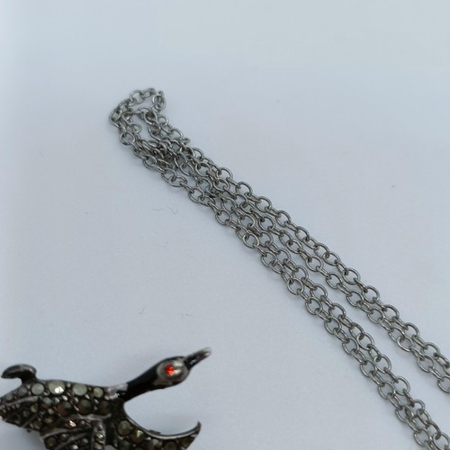 168 - A silver coloured metal whale fin pendant, on a chain, and assorted other jewellery