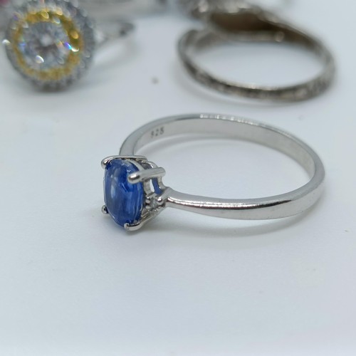 170 - A silver coloured metal and blue stone dress ring, and assorted other dress rings