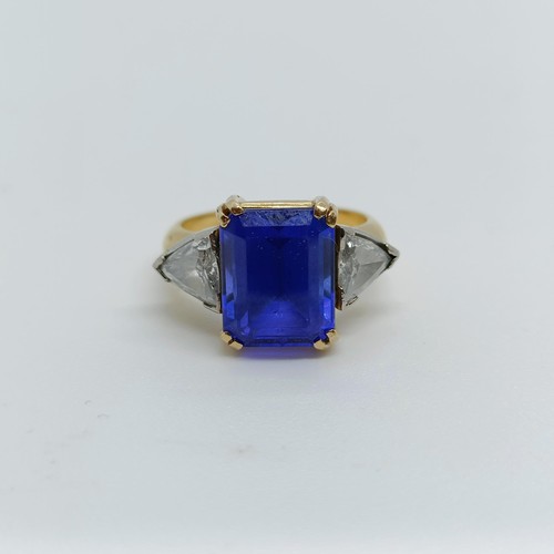 176 - An 18ct gold, blue tanzanite and trilliant cut diamond three stone ring, ring size H 1/2 Provenance:... 