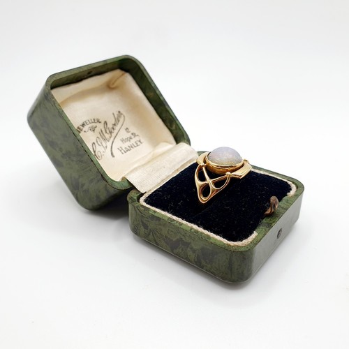 142 - An 18ct gold and opal ring, by Murrle Bennett, ring size P, in a vintage jewellery box, retail label... 