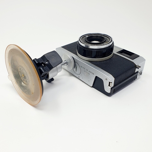 15 - An Olympus 35 RC camera, with a stand
Provenance: From a single owner collection