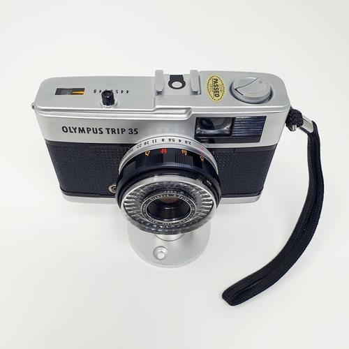 17 - An Olympus Trip 35 camera, and a stand
Provenance: From a single owner collection