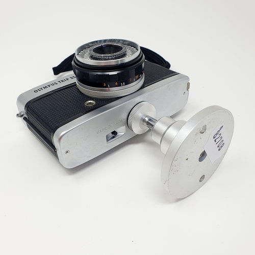 17 - An Olympus Trip 35 camera, and a stand
Provenance: From a single owner collection