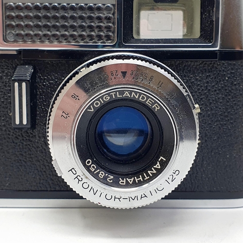 21 - A Voigtlander Vito Auto 1 camera, with a copy of its original manual
Provenance: From a single owner... 
