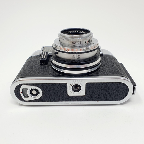 21 - A Voigtlander Vito Auto 1 camera, with a copy of its original manual
Provenance: From a single owner... 