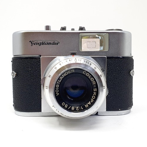 23 - A Voigtlander Vito B camera, and a Voigtlander Vito CLR camera, with a stand
Provenance: From a sing... 