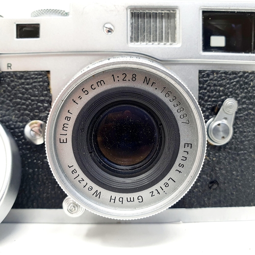 47 - A Leica M2 camera, No. 1076357 with an Elmar F=5cm 1:3.5 lens, No. 1333968
Provenance: From a single... 