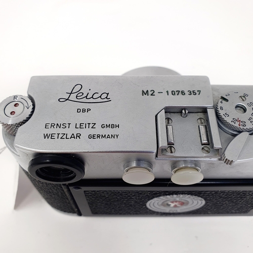 47 - A Leica M2 camera, No. 1076357 with an Elmar F=5cm 1:3.5 lens, No. 1333968
Provenance: From a single... 