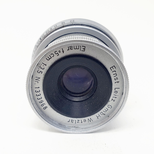 53 - A Leica Elmar f=5 cm 1:3.5 Nr lens, No. 1333968, with a Leica lens cap
Provenance: From a single own... 