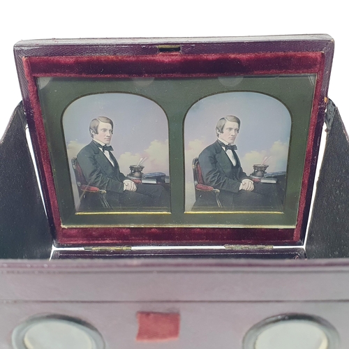 57 - A Victorian stereoscopic daguerreotype viewer, the leather case with a retail  mark for Mr Kilburn, ... 