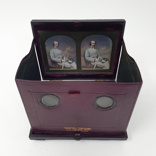 58 - A Victorian stereoscopic daguerreotype viewer, the leather case with a retail  mark for Mr Kilburn, ... 