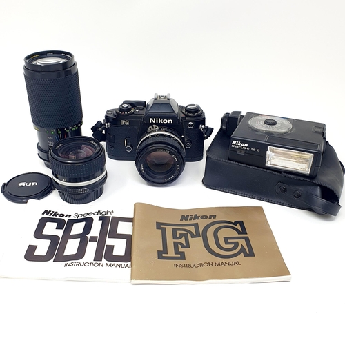 70 - A Nikon FG camera and lens, two other lenses, a carry case, and an 8 mm cine projector (2)