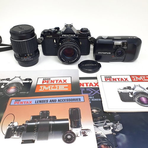 75 - A Pentax ME camera, a lens, a light meter, and an Olympus pocket camera (box)