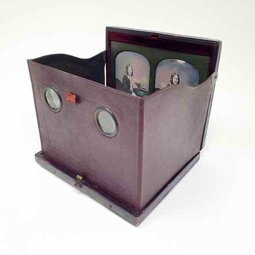 82 - A Victorian stereoscopic daguerreotype viewer, the leather case with a retail  mark for Mr Kilburn, ... 