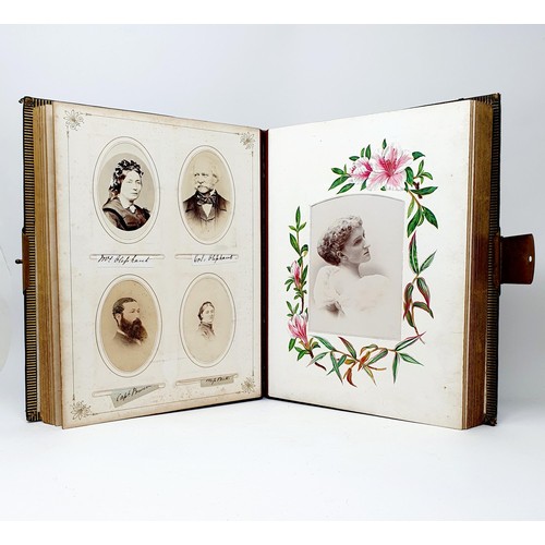 85 - A Victorian leather bound photograph album, with assorted images