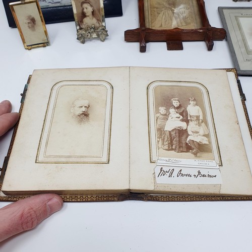 86 - An early 20th century leather double photograph frame, another photograph album, and assorted other ... 