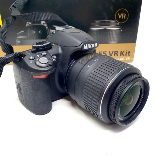 90 - A Nikon D3100 digital camera and two lenses, boxed