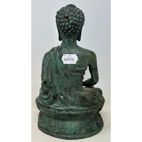 714 - A bronze Buddha, 30 cm high