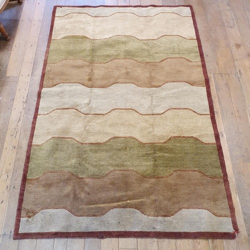 939 - A cream ground Caucasian rug, 195 x 113 cm