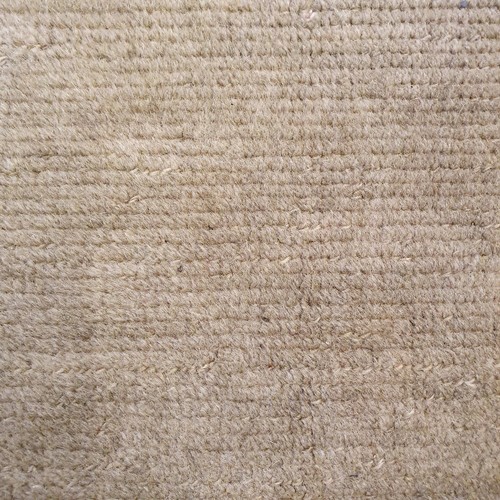 939 - A cream ground Caucasian rug, 195 x 113 cm