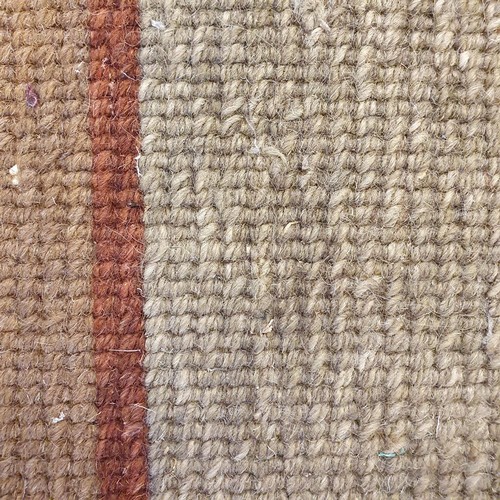 939 - A cream ground Caucasian rug, 195 x 113 cm