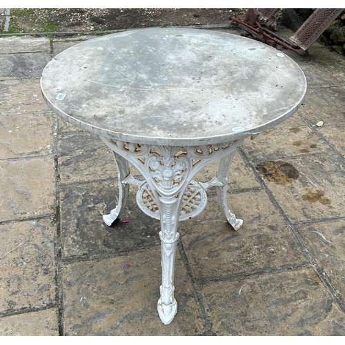 1049 - A Britannia style painted metal table, with a marble top, 76 cm diameter